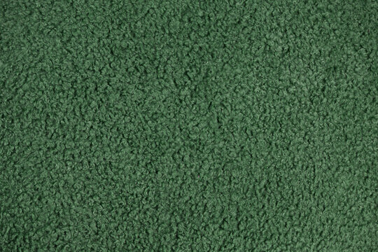 Green curly boucle fabric texture background