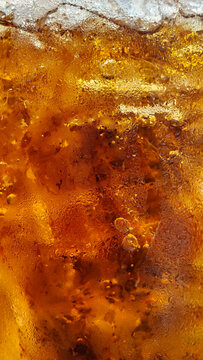 A refreshing macro texture details macro shot drink ice on glass and water dropes.jpg with condensation