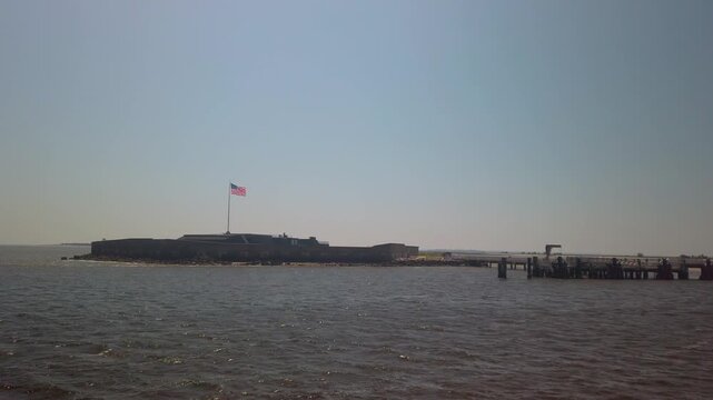 Gimbal shot from a moving ferry boat approaching historic Fort Sumter in Charleston Harbor, South Carolina. 4K at 60 FPS Slow Motion