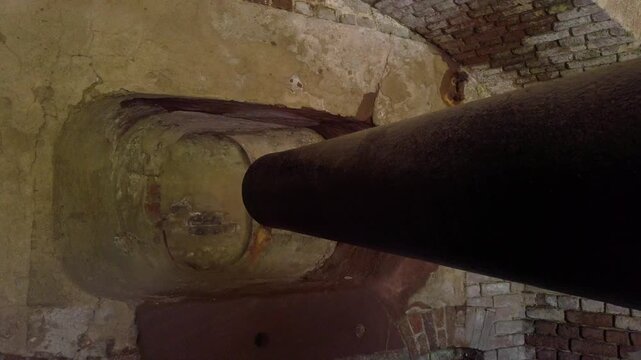 Gimbal close-up panning shot of a long cannon barrel at Fort Sumter in Charleston, South Carolina. 4K