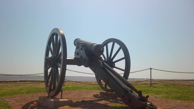 Gimbal close-up panning shot of a Civil War-era cannon at Fort Sumter in Charleston, South Carolina. 4K
