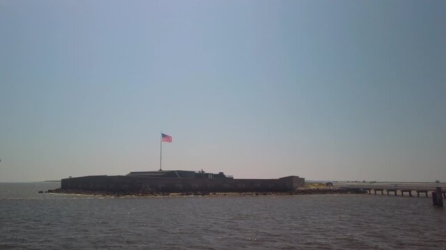 Gimbal wide booming down shot of historic Fort Sumter in Charleston Harbor, South Carolina. 4K