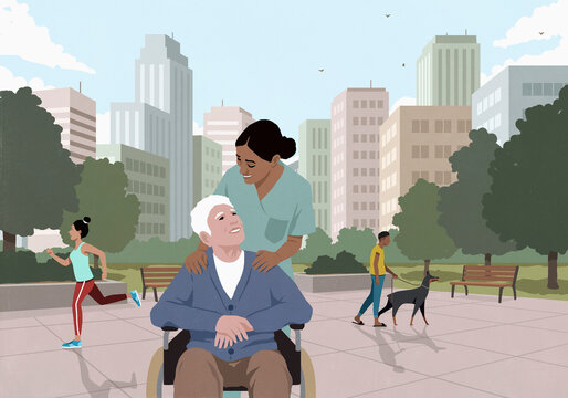 Happy, friendly female caregiver with senior man in wheelchair in city park