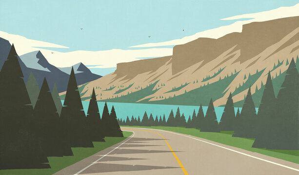 Scenic view of road winding through mountains along lake in sunny, scenic summer landscape