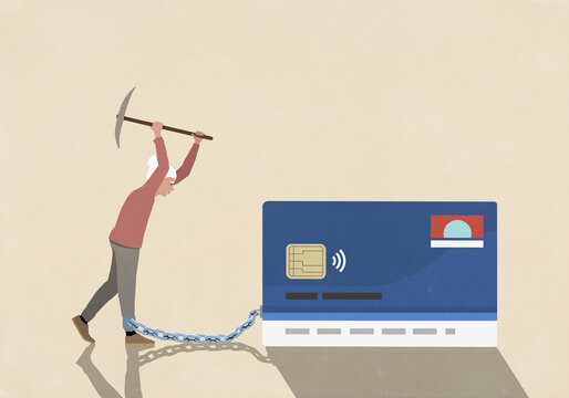 Senior woman with axe attempting to break chain attached to her ankle and credit card