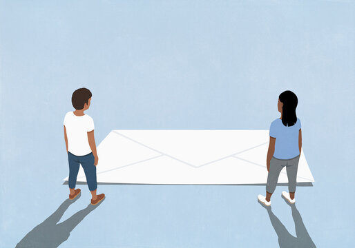 Man and woman looking down at large white envelope against blue background