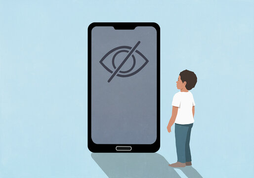 Young boy looking at privacy control symbol on smart phone screen against blue background