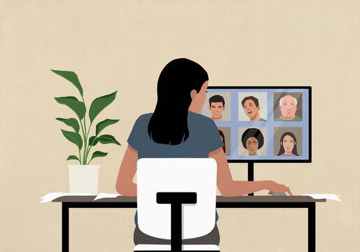 Businesswoman video conferencing at computer screen in office