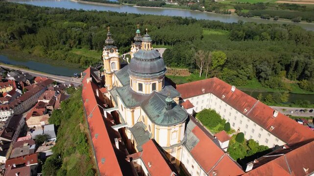Melk Abbey Aerial Drone View Close Up Half Orbit Revealing Benedictine Monastery Complex Danube River Landscape Lower Austria Medieval Baroque Architecture Panorama Travel Destination UNESCO