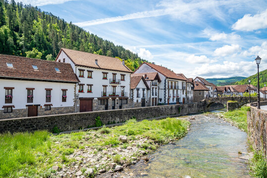 Traditional houses along a river in the medieval town of Ochagavia, Salazar Valley, Navarre, Spain