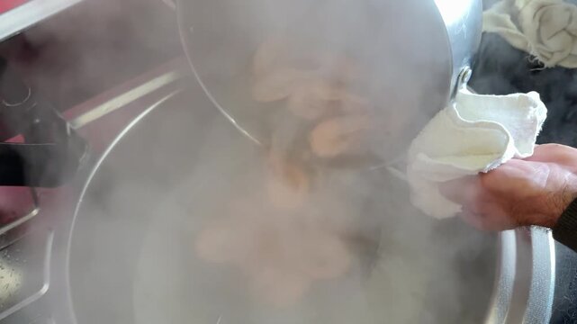 Step by step shrimp cooking process including boiling water adding shrimp into pot stirring during cooking draining through sieve rinsing and serving seafood. white plate.