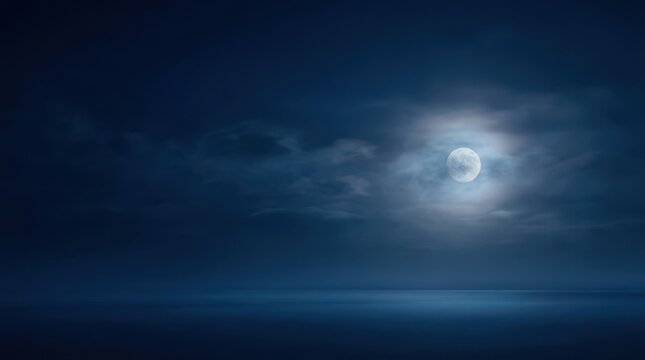 A serene night scene with a bright full moon shining through light clouds over a calm body of water.