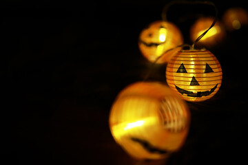 Obraz premium Close-Up of Illuminated Jack-O'-Lantern Lights for Halloween Decoration