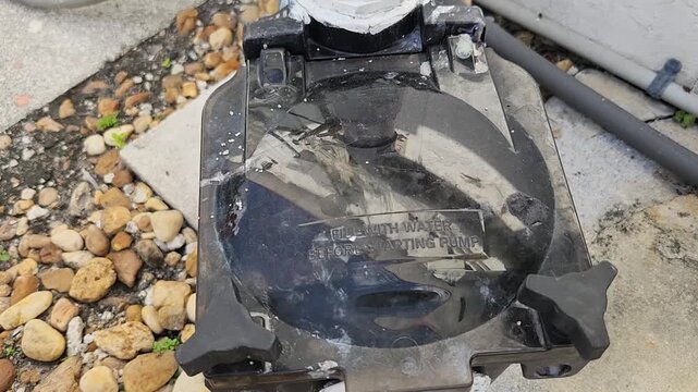 Angled view of swimming pool pump and filtration assembly