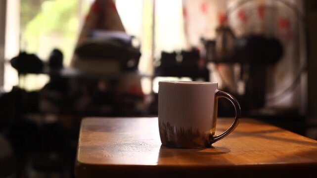 mug of coffee and Filipino food called Pandesal being placed on a small table.