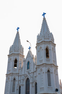 Gothic architectural spires and upper facade of the Basilica of Our Lady of Good Health in Velankanni, Tamil Nadu, India.