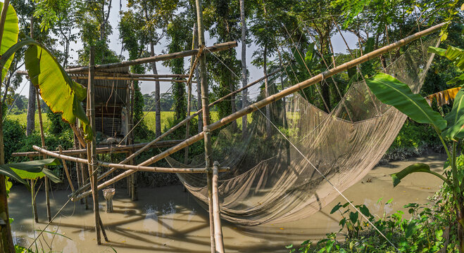 Closeup view of traditional bamboo chinese fishing net in rural countryside, Barisal, Bangladesh