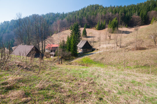 View of the traditional wooden cottages of the Prasnica - old charcoal burners' settlement nestled in a mountain valley Stare Hory, Banskobystricky kraj, Slovakia.