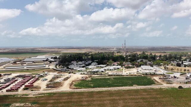Aerial View Of Nir Oz Near Gaza Border Israel
Drone footage overlooking Nir Oz kibbutz and Shujaiyya Gaza skyline May 26 2026 Israel
