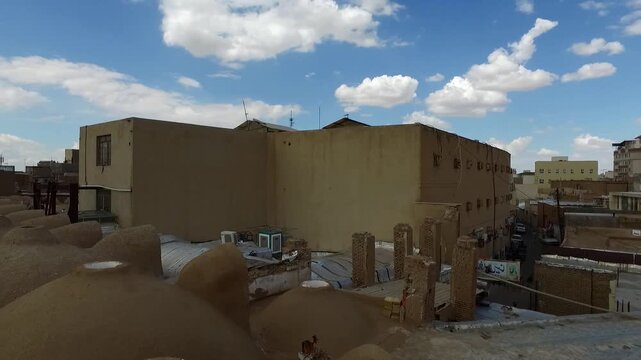 Traditional mud brick houses in village creating cultural architecture and rural documentary footage perfect for travel stock video.
