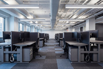 Fototapeta premium Modern Office Interior With Bright Daylight and Clean Work Areas for Business and Corporate Use