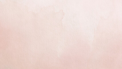 Fototapeta premium Soft pink watercolor background with a subtle textured paper effect.