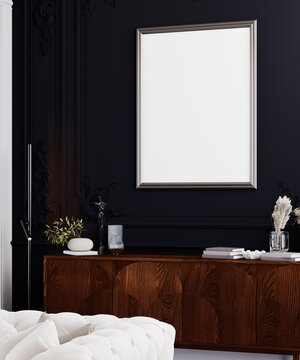 Elegant dark luxury interior with classic wall moldings, tufted sofa and vertical poster mockup frame.
