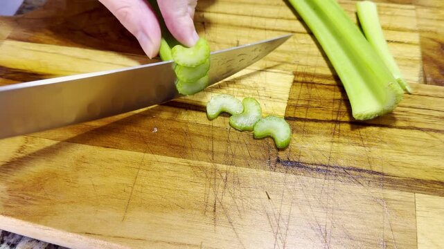 Cutting celery for a Lasagna, Homemade cooking.	