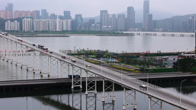 Governador Nobre de Carvalho Bridge close-up. Macau cityscape in background