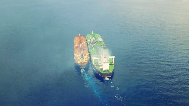 Drone footage of an Iranian ship to ship oil tankers transferring oil evading sanctions
