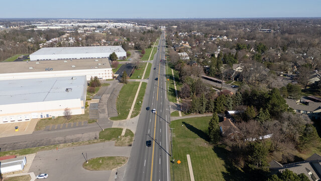 Aerial view of a highway passing through industrial zone