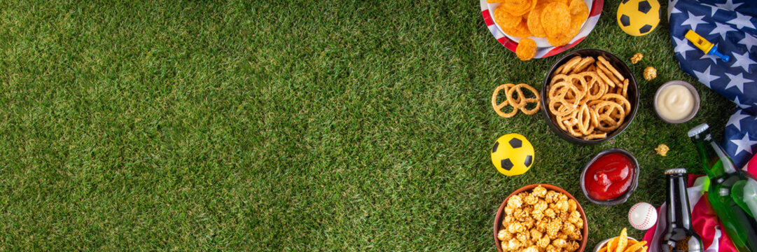 International football soccer championship background, soccer matches cheering concept with beer bottles, party snacks chips, popcorn, pretzel, nuts, whistle and soccer ball, american flag, copy space