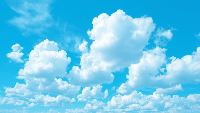 Beautiful blue sky with white fluffy clouds on a sunny day  natural scenery