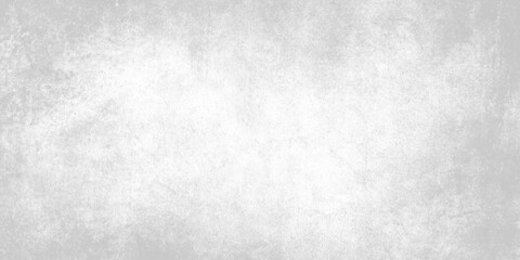 Fototapeta premium Gray textured wall surface with white patches and subtle background pattern