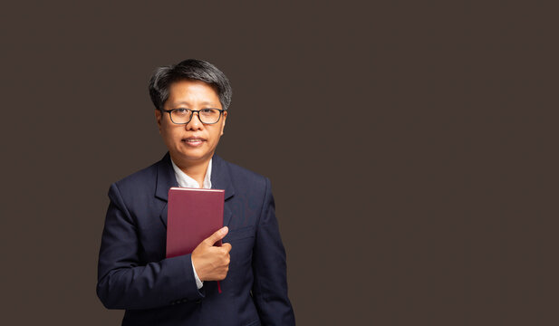 Female CEO Holding Book in Business Portrait