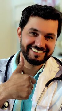 Indian Asian handsome male doctor shows thumbs up with senior old-aged patient in OPD, both smiling warmly at the camera, symbolizing trust, successful treatment, and quality healthcare