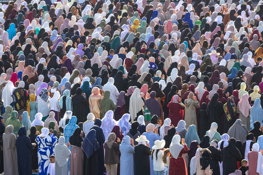 Mulhouse, France - 27 May 2026: View of a large crowd of Muslim women wearing colorful hijabs and traditional clothing gathered at Stade de l'Ill for Eid al-Adha prayer.