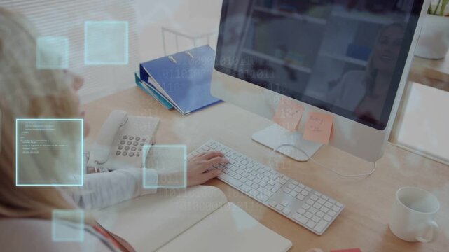 Woman typing at keyboard and using mouse, activating subtle squares while preparing marketing deck