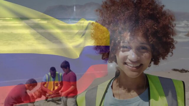 Volunteer smiling while flag drifting, causing team digging sand into red bucket for beach cleanup