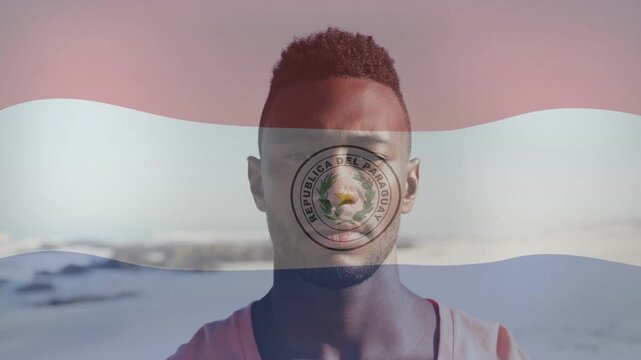 Man at shoreline, Paraguayan flag overlay appearing and waving across face for marketing