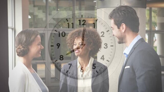 Left woman reaching and shaking hands with exec while center business host nodding, clock rotating
