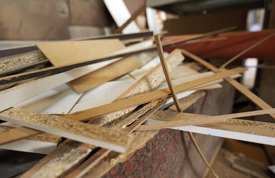 Wood chipboard scraps and debris from construction waste