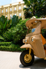 Obraz premium Unique wicker tuk-tuk awaits visitors outside the elegant Boutique Dior Gold House on Phloen Chit Road Lumphini Bangkok Thailand on April 27 2026