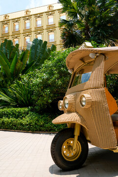 Unique wicker tuk-tuk awaits visitors outside the elegant Boutique Dior Gold House on Phloen Chit Road Lumphini Bangkok Thailand on April 27 2026
