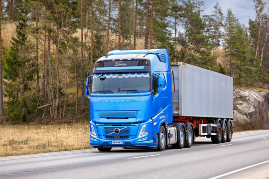 Blue Volvo FH Aero Truck Semi Trailer on Road.
