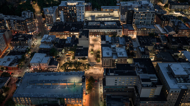 Ithaca, NY, USA - 05-18-2026  Night aerial photo of Ithaca, NY downtown, commons, on a spring evening.