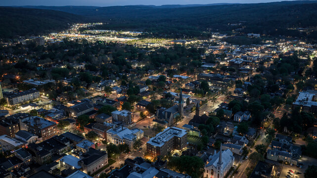 Ithaca, NY, USA - 05-18-2026  Night aerial photo of Ithaca, NY downtown, commons, on a spring evening.