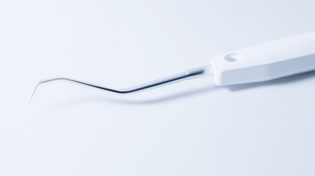Close-up view of an adenoid curette instrument positioned in a clinical setting