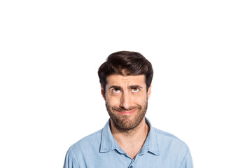 Obraz premium Photo of amazing mixed race guy looking up empty space making fake smile seeing terrible high shopping prices wear casual denim shirt isolated white color background