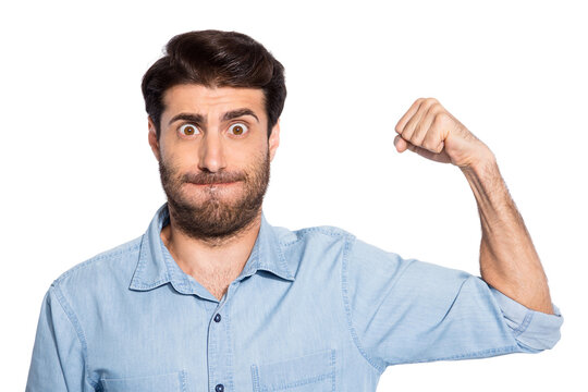 Photo of amazing handsome guy raising arm showing perfect biceps shape pushing hard at sport gym wear casual denim shirt isolated white color background